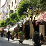 Cafe lined street in Seville.