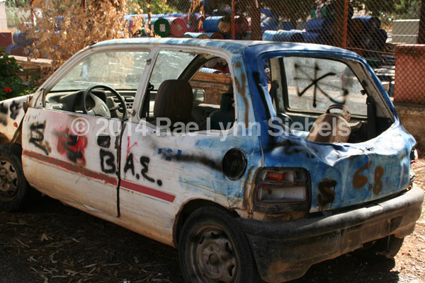 old car covered with graffiti